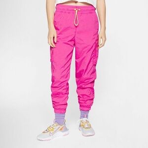 NIKE ICON CLASH PANTS IN FIRE PINK/LASER ORANGE